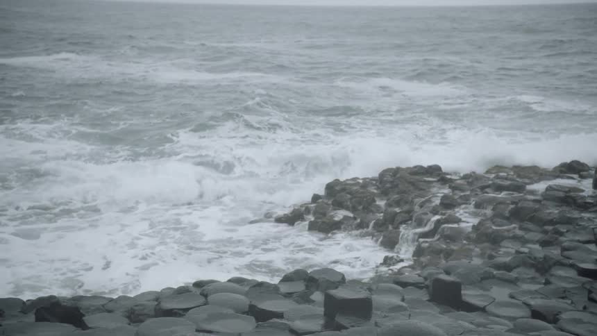 A beach with a rocky shore