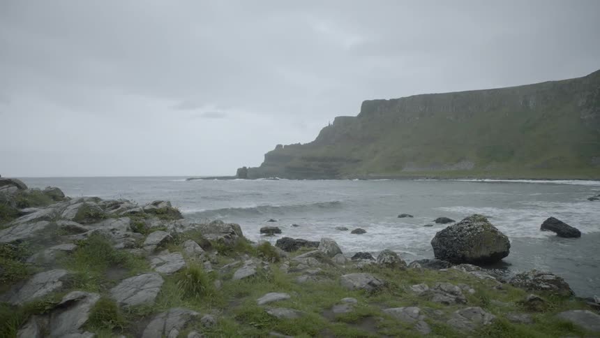 Waves roll in along a rocky coast
