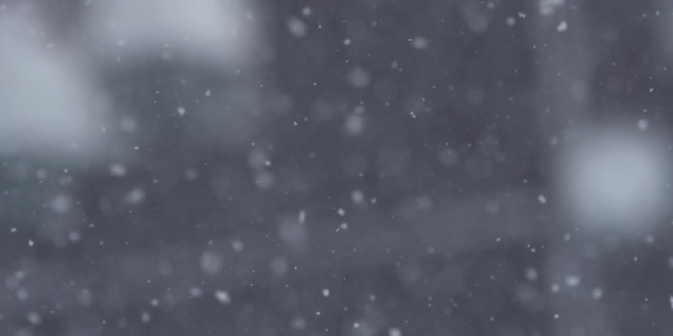The snowflakes slowly fall in the town