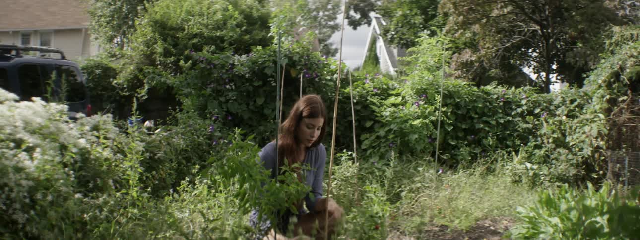 A woman looking at plants