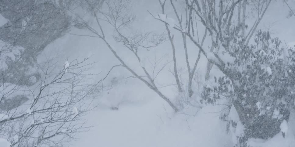A person skiing down a slope