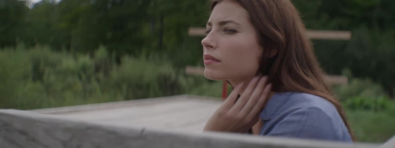 A woman sits on a trailer