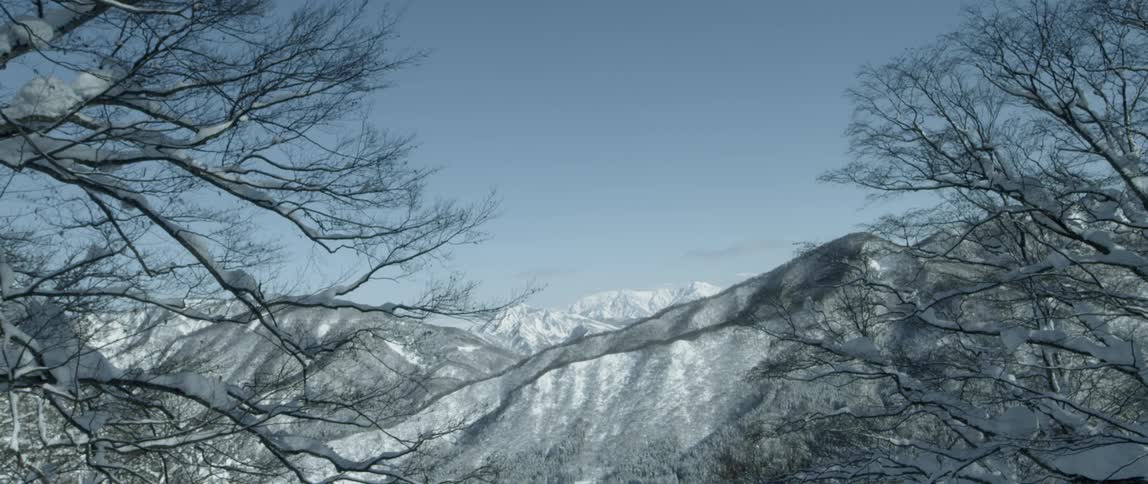 A mountain range that has snow on top of it