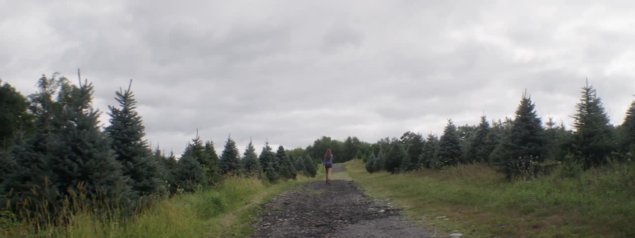 A woman is running along a trail