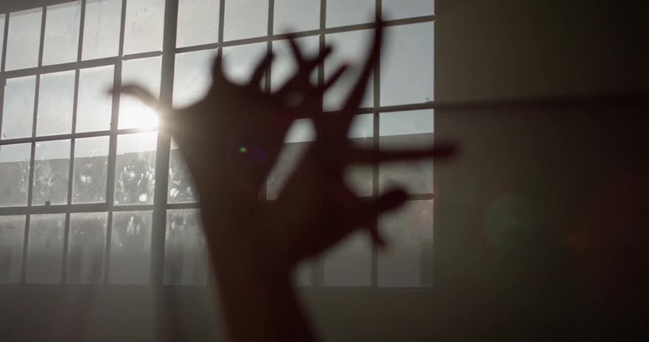 A woman moves her fingers into various shapes