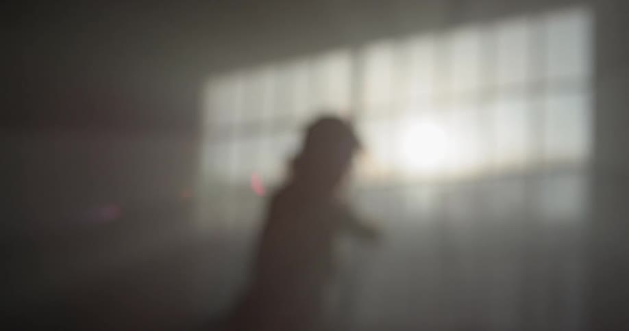 A ballerina dancing in an empty room