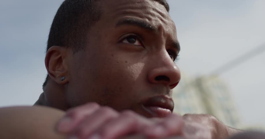 A man outside staring and thinking