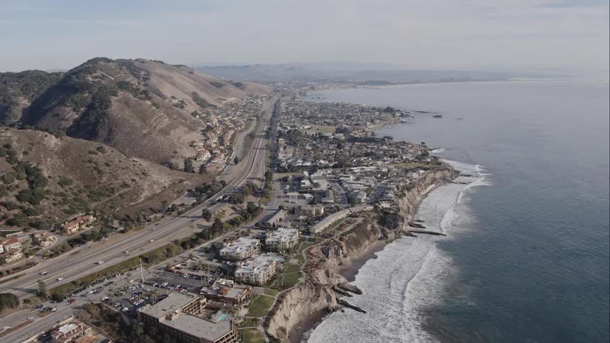 A town along a coastline and a highway