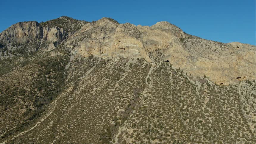 An aerial view of a mountain landscape on a clear day