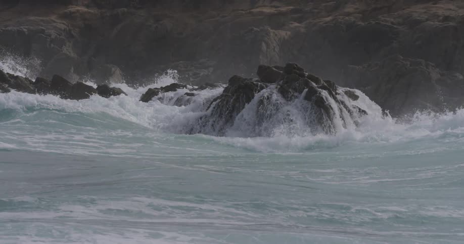 Ocean waves crashing on a rocky shore