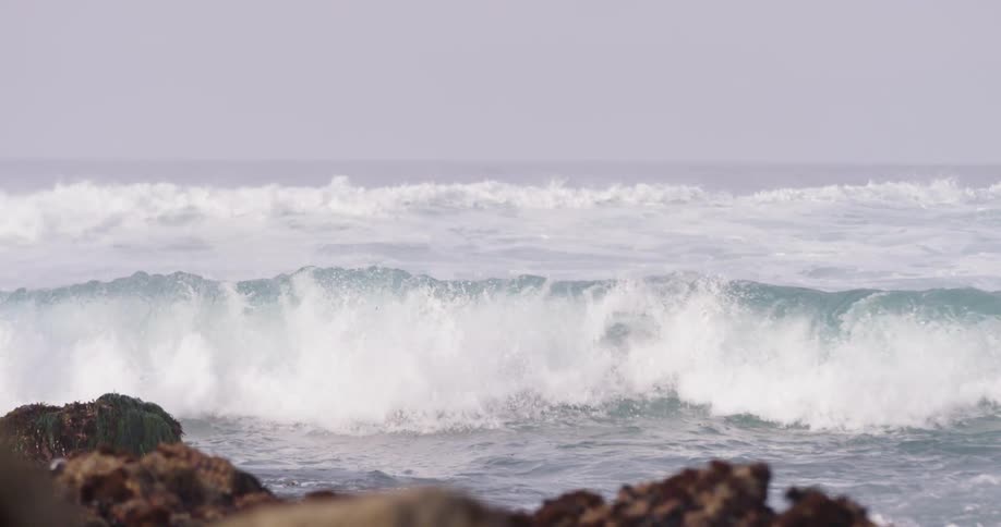 Big ocean waves crashing on the rocks