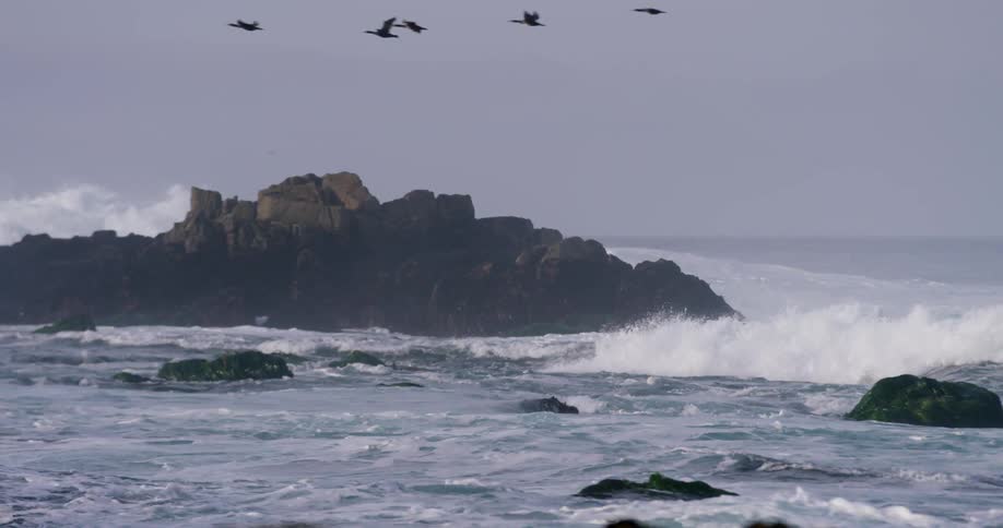 Ocean waves crashing on the rocks of a beach