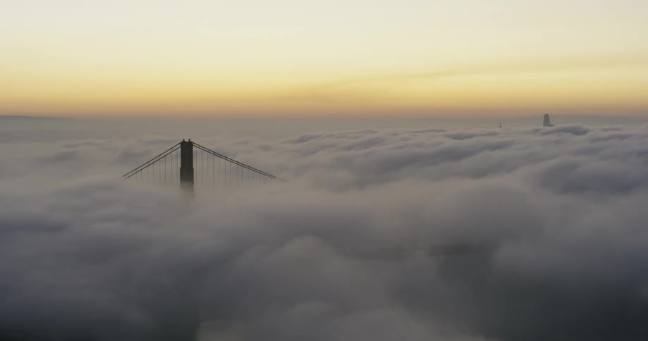 Clouds covering a bridge