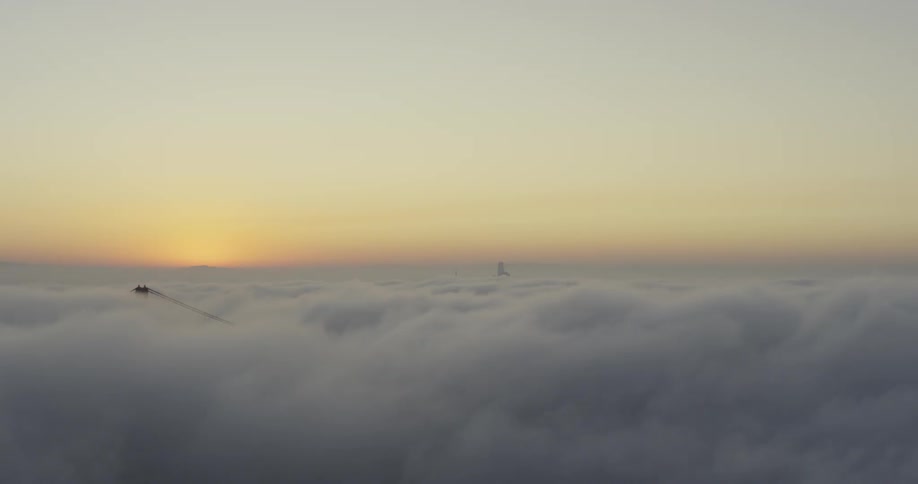 The sun is setting behind the heavy clouds