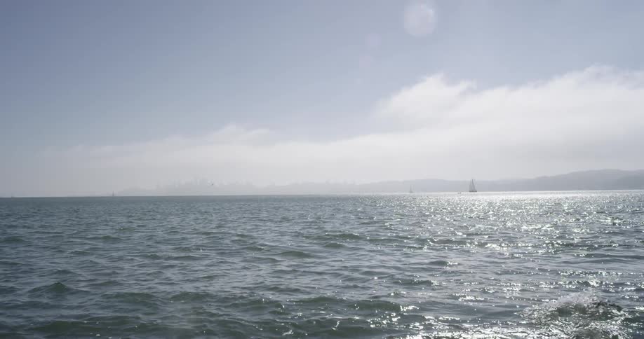 Waves lap gently across a body of water