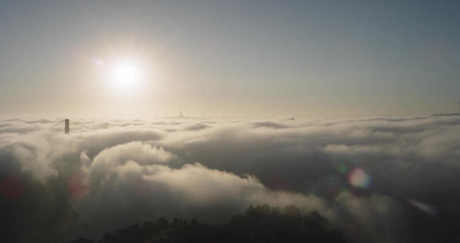 A bridge is covered by a thick fog