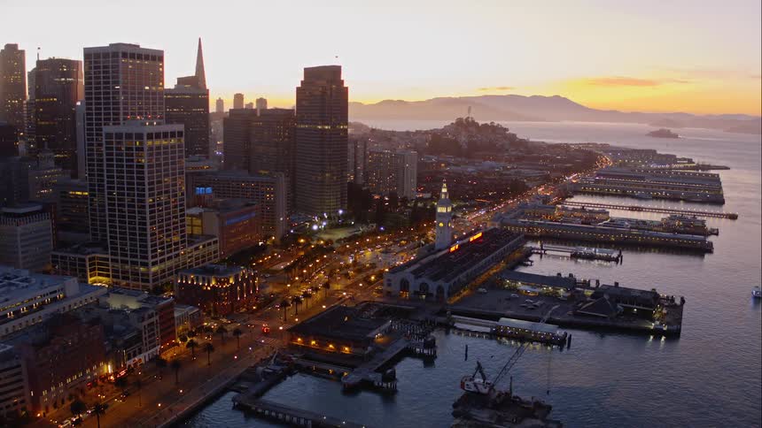 The coastline of a metropolis at sunrise