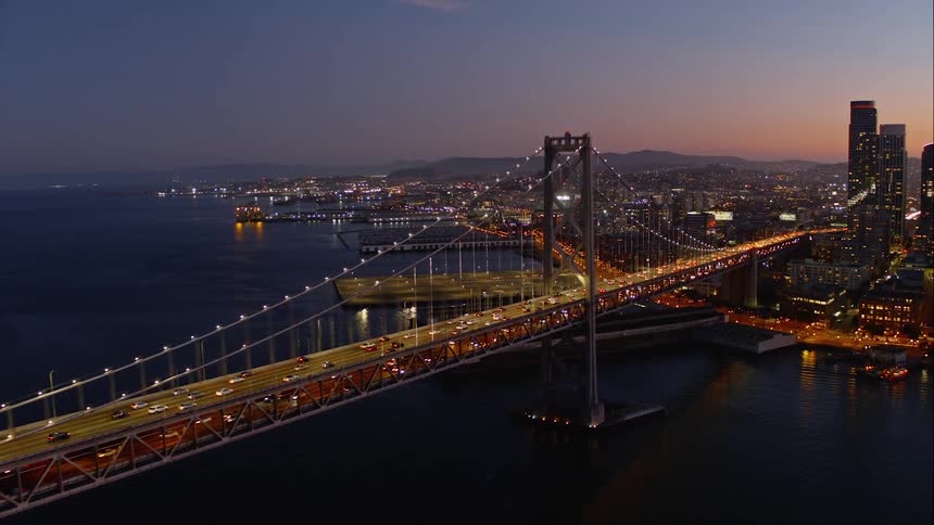Skyline view of a busy bridge going in to the city