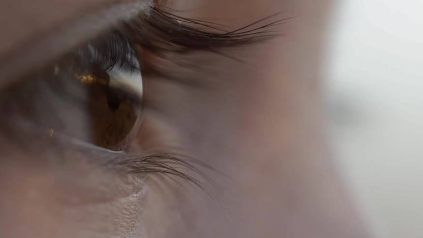 A woman with brown eyes staring