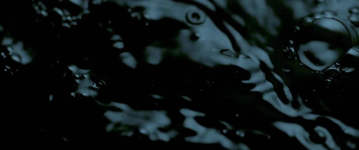 Drops falling onto the surface cause ripples and waves