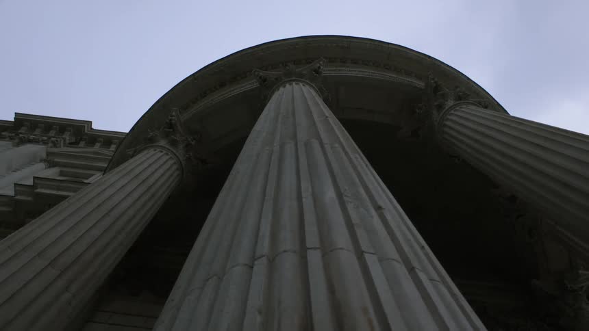 Pillars on a building tower overhead
