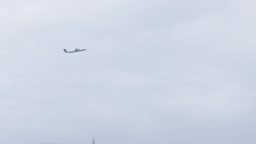 Plane taking off and flying through the sky