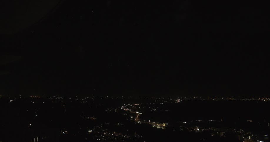 Fireworks explode in the dark night sky