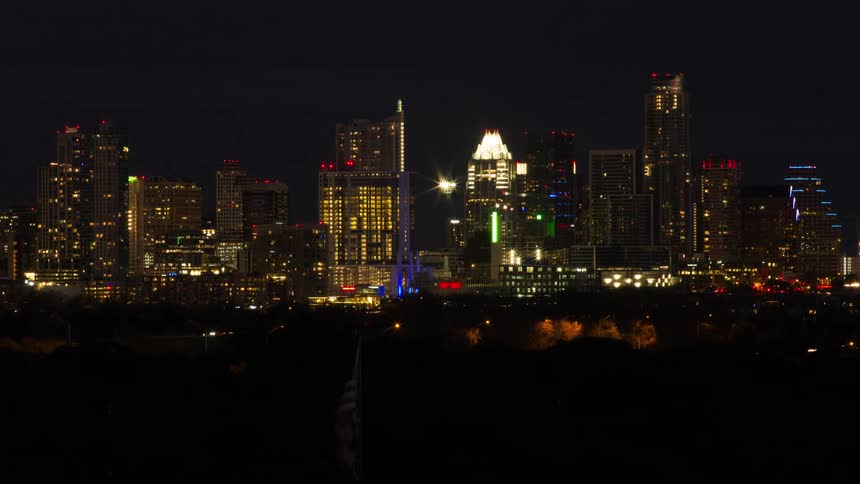 Time lapse of a large lit city at night
