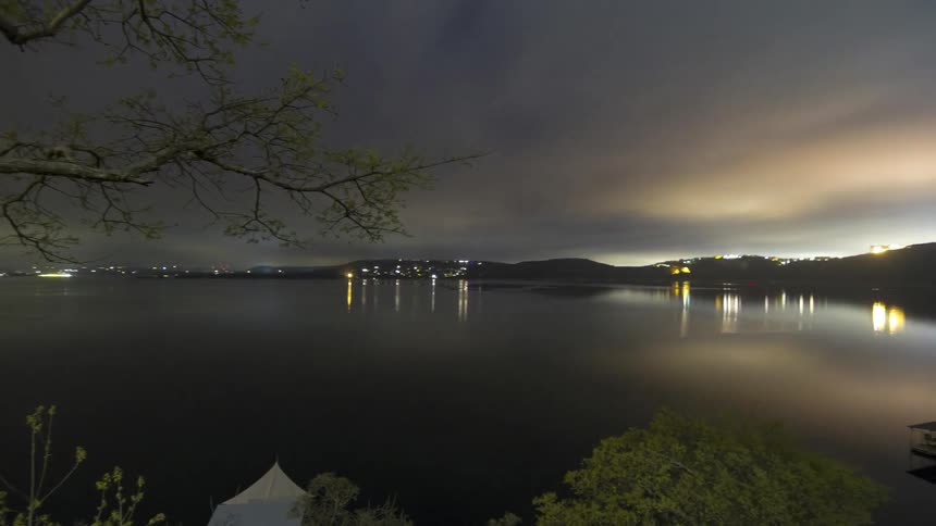 The clouds roll over a lake