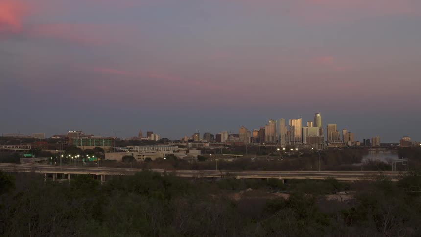 Time lapse of a highway and austin skyline
