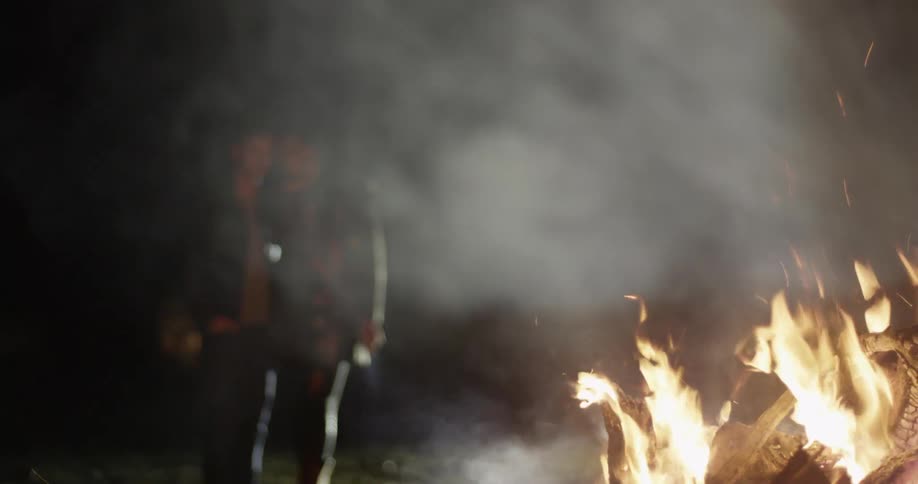 People watching campfire