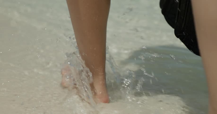 Woman walks on a beach