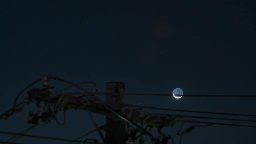 The moon is moving in the sky outdoors