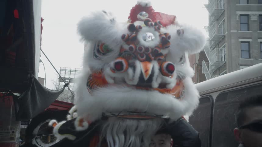 A chinese dragon dances on the street