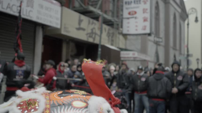 A chinese lion dances on the street