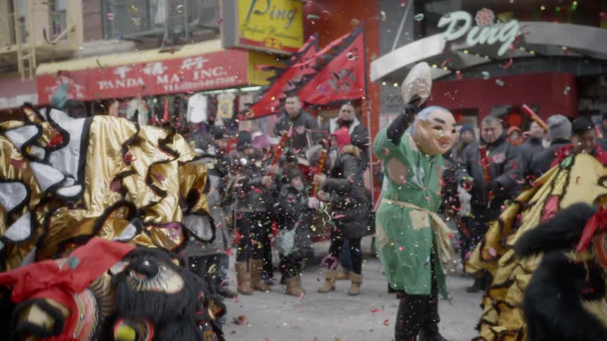 People dress up and celebrate in the street at a chinese festival