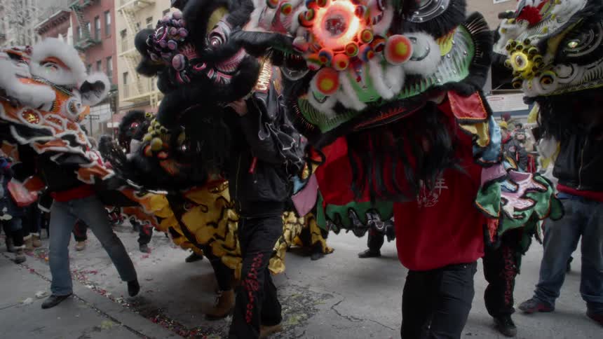 A crowd of people in costumes dancing
