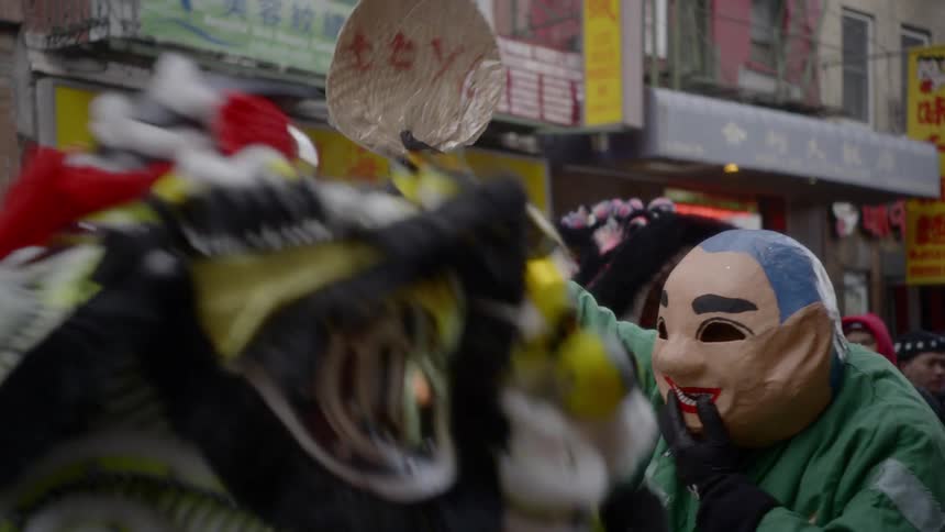 A festival with chinese dragons and people in costume