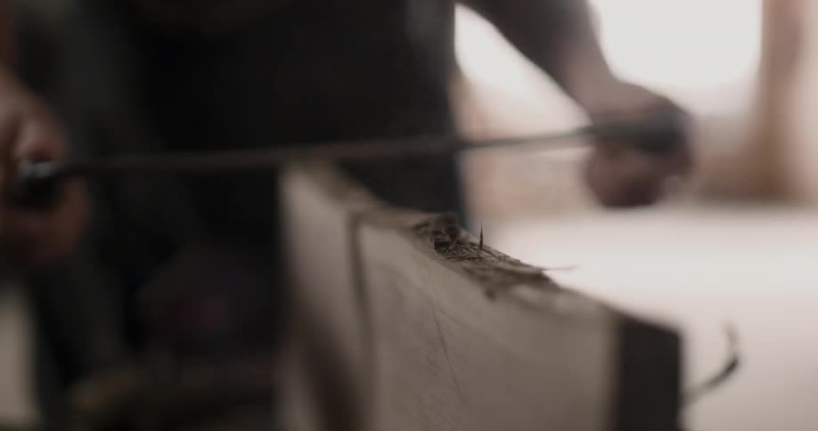 Wood being chiseled from a board