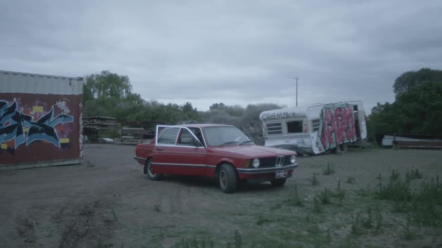 A static shot of an abandoned car