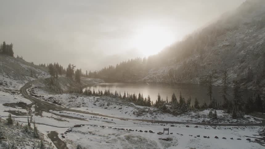 Snow is falling on the horizon at dusk