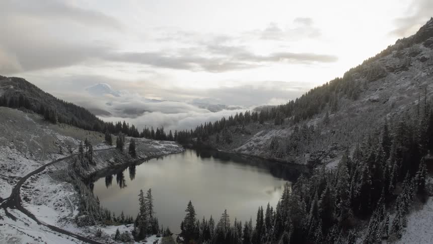 A lake sits in a mountain valley