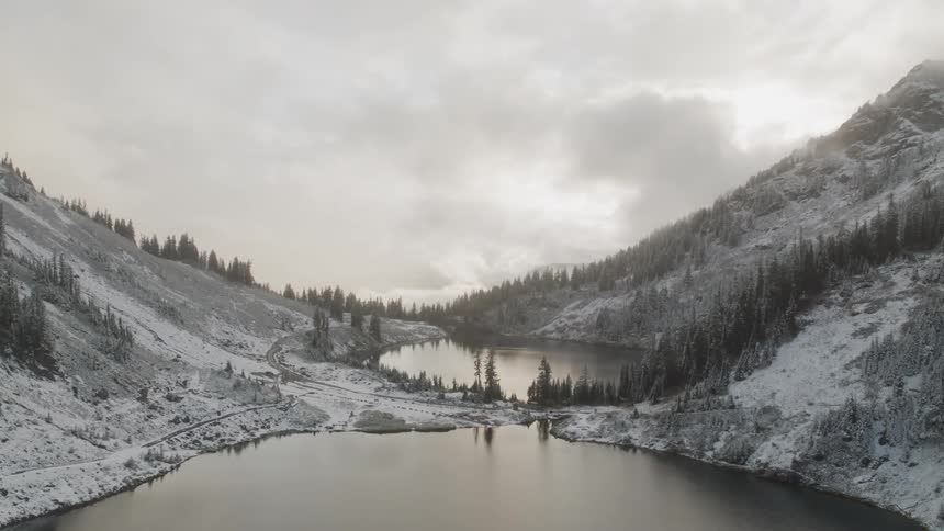 A lake sits in a mountain valley