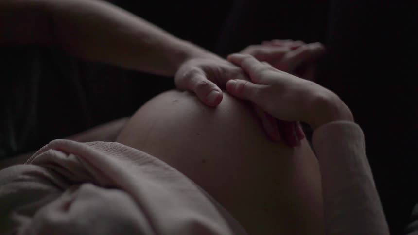 Hands on pregnant belly