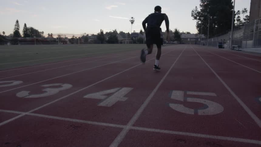 A man starting to run a lap