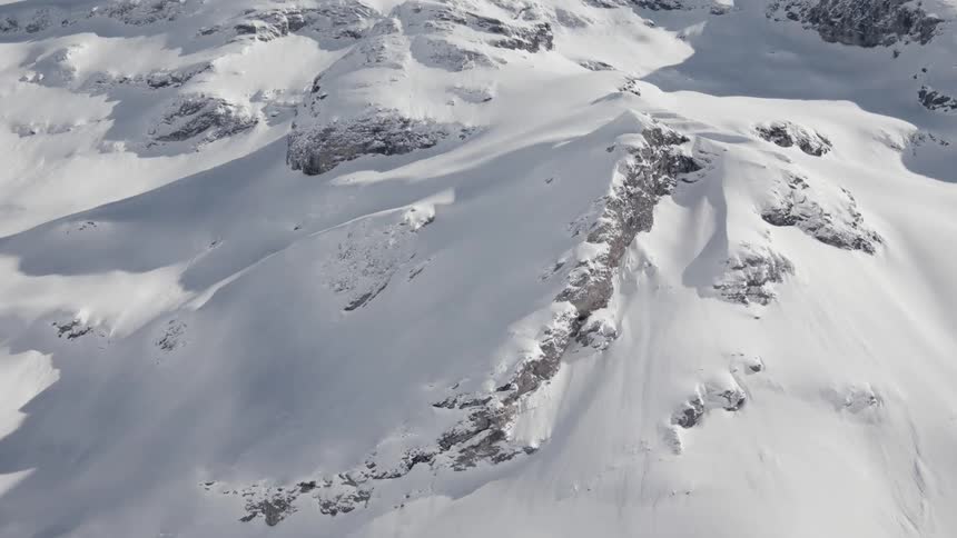 A mountain range covered in deep snow