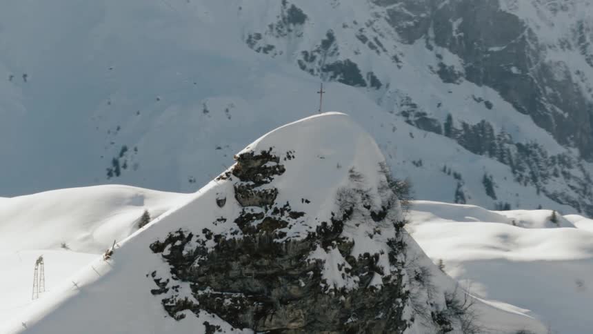 The sun is hitting the mountain tops