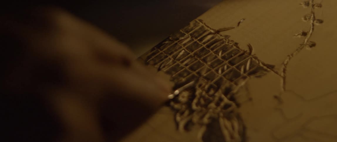 A person is etching a design