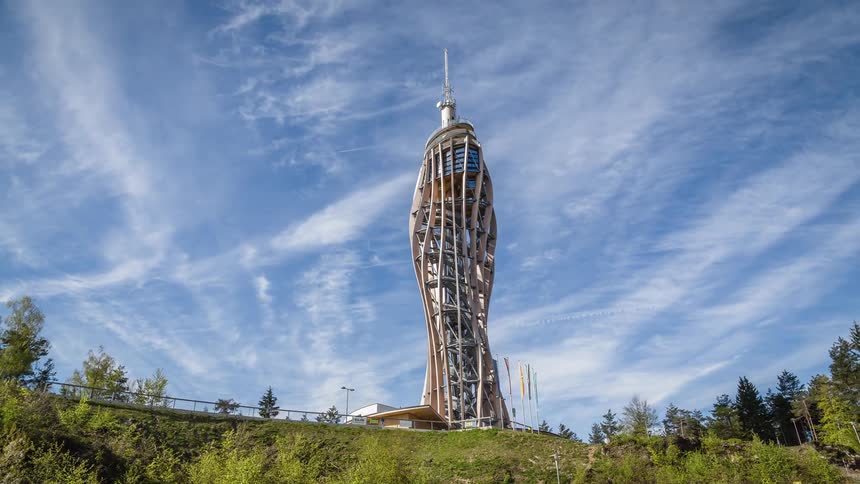 A modern architectural structure rises into the sky