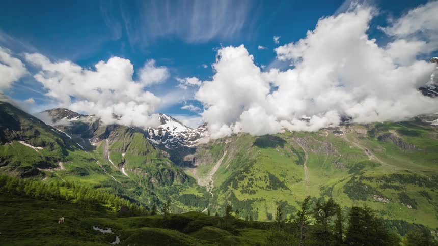 Clouds roll and move over mountain tops